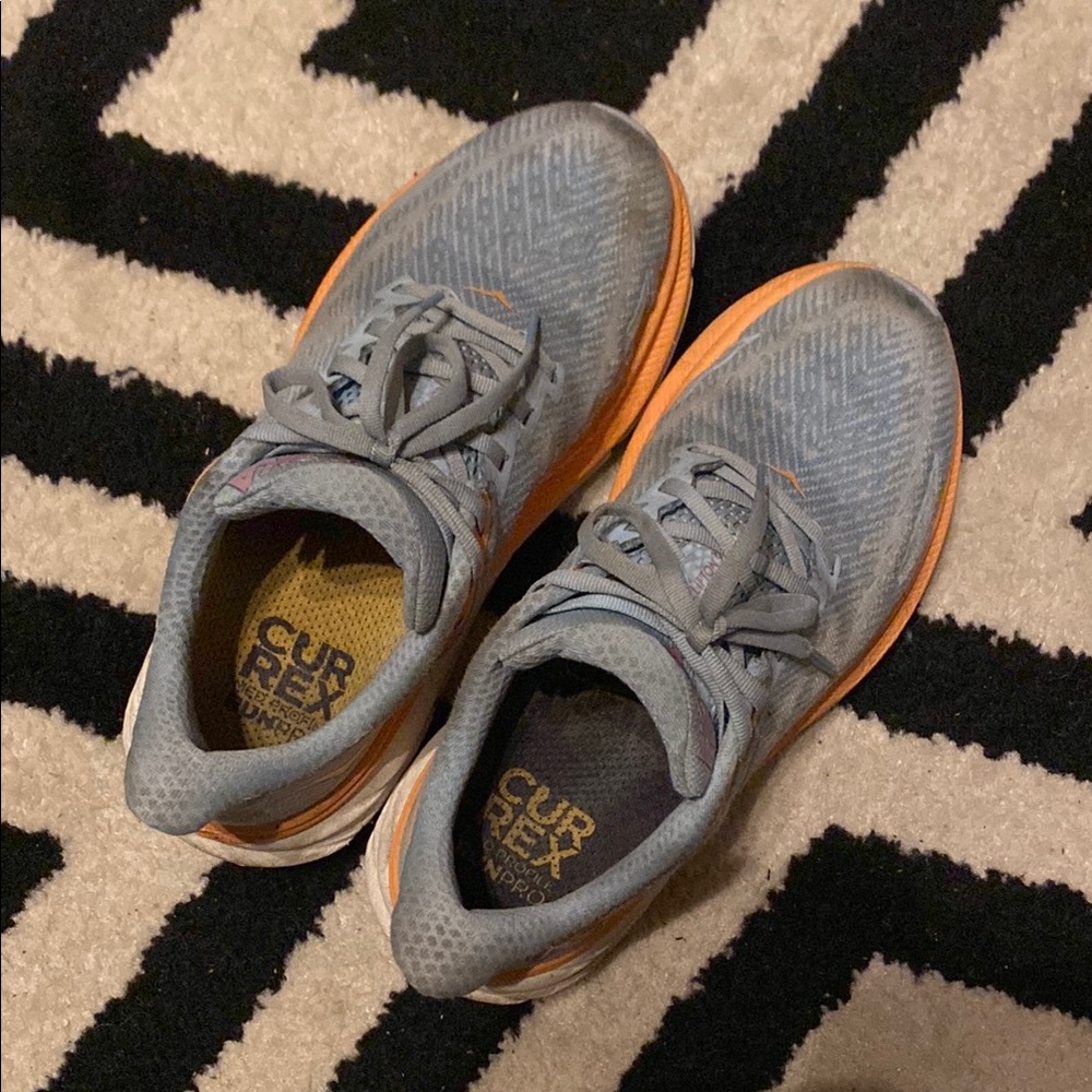 Used HOKA Clifton 9 sneakers. Very comfortable.